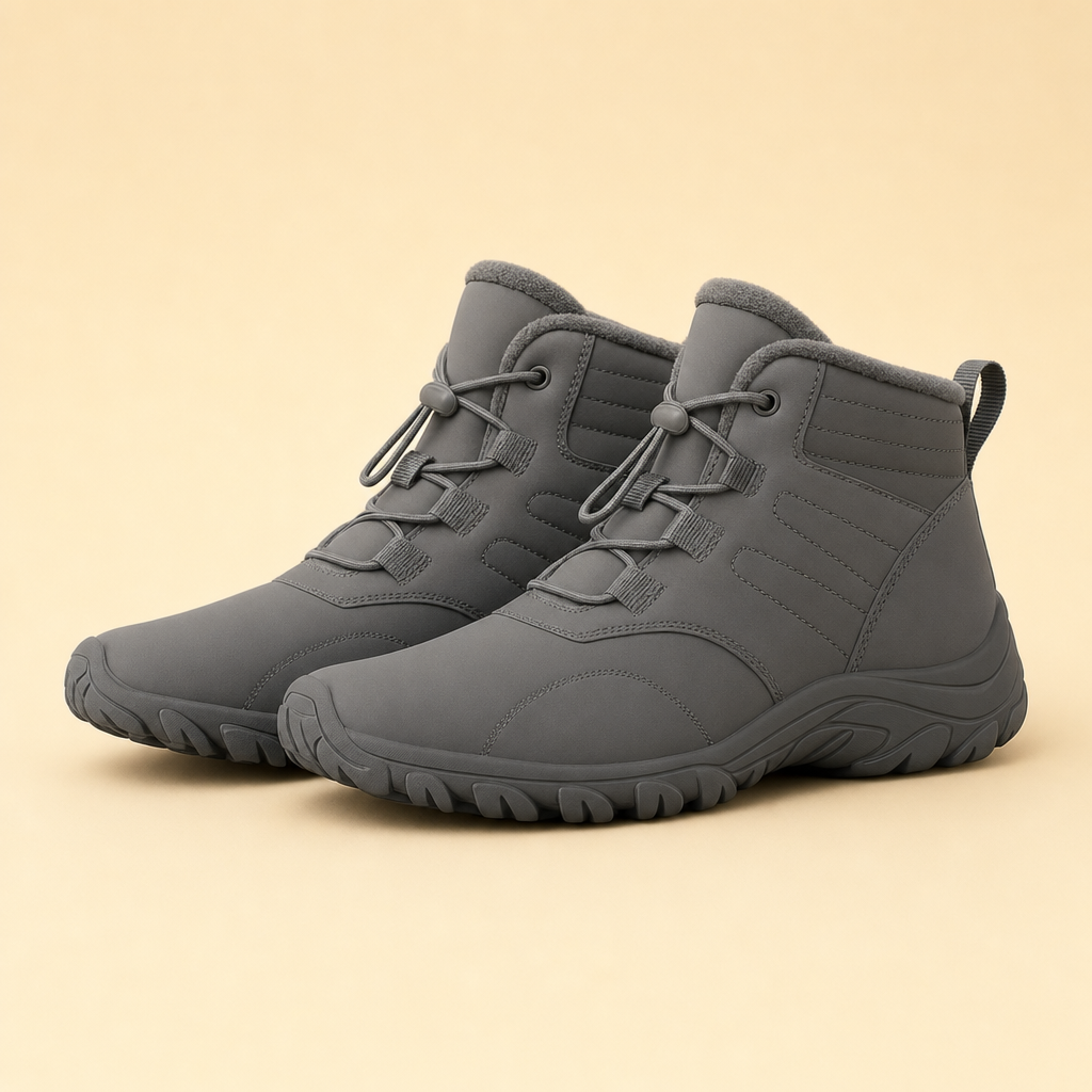 Glacova winter barefoot shoes in grey on a beige studio backdrop